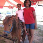 Girl Enjoying Her Pony Ride